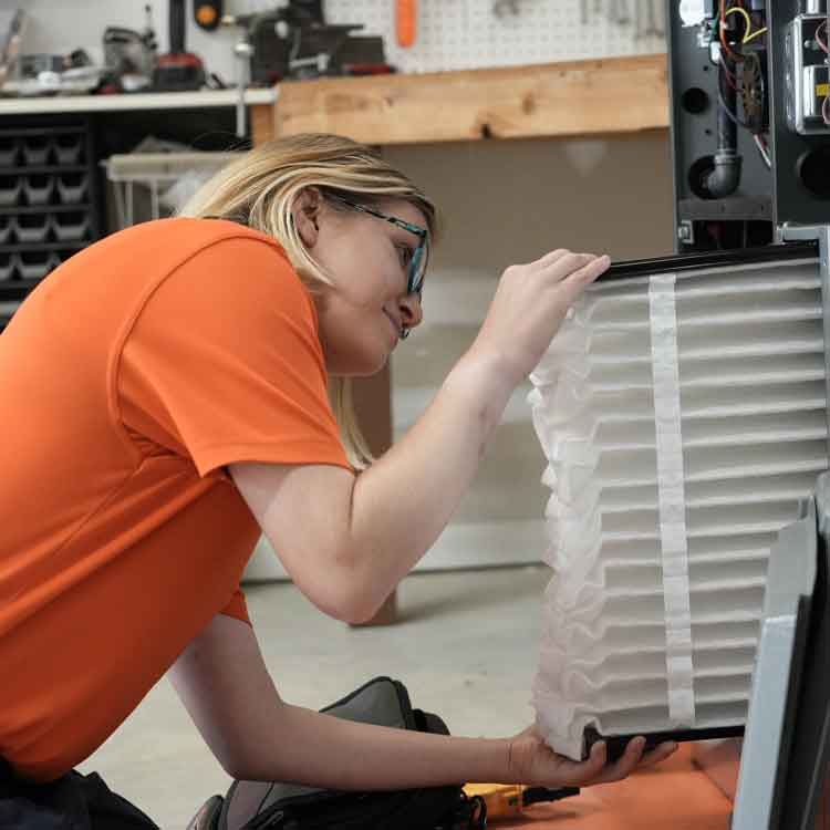 Summers air technician working on improving indoor air quality