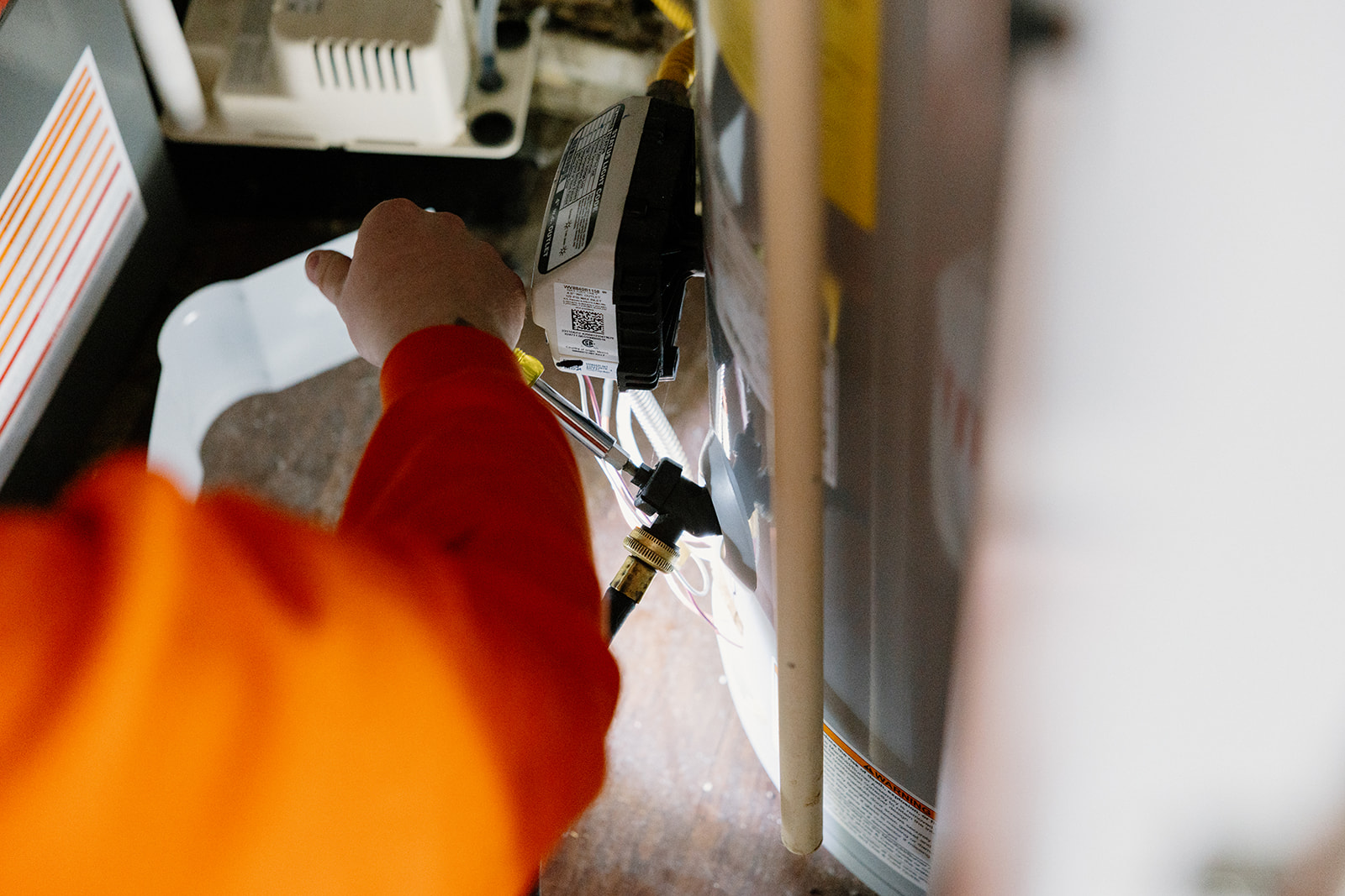 Summers Plumbing, Heating & Cooling technician performing AC service on a Lennox outdoor air conditioning unit at a Kokomo, Indiana home